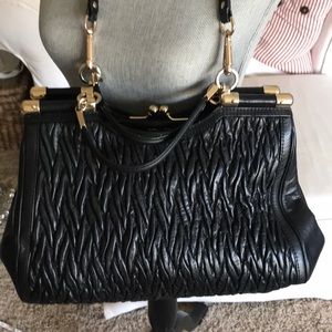 Black Coach purse with purple lining